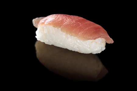 Tuna sushi on black.の写真素材