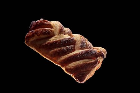 Shot of fresh pastries isolated on black background.の写真素材