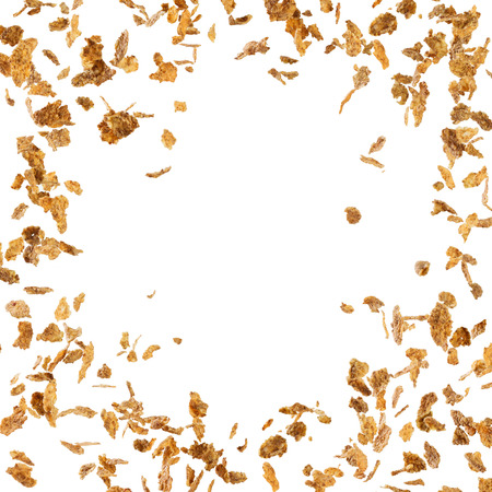 Falling corn flakes isolated on white background