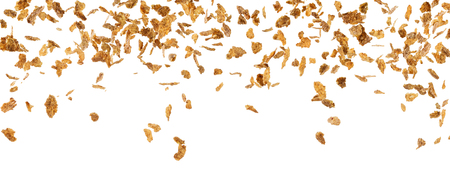 Falling corn flakes isolated on white
