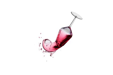 Red wine splash out of a wineglass .の写真素材