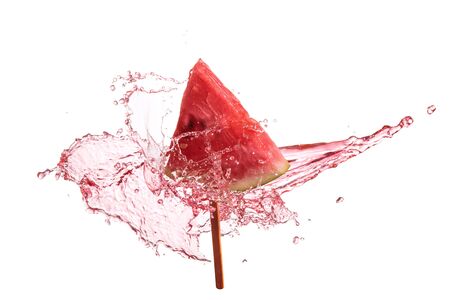 Slice of watermelon with splash of pink juice.の写真素材