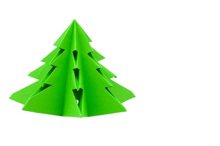Origami Christmas tree, hand made of green paper in kindergarten. Isolated on white backgroundの写真素材