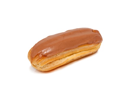 Choux pastry eclair, covered with icing. Isolated on white background