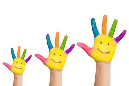 Three colorful hands with smile of family - mother, father and babyの写真素材