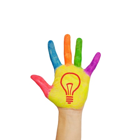Light bulb (idea concept) on a colorful child's hand. Isolated on white background.の写真素材