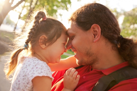 Happy father and daughter playing and laughing together. の写真素材