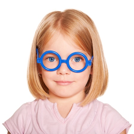 The little blue-eyed girl with glasses. Close-up portrait. Isolated on white background.の写真素材