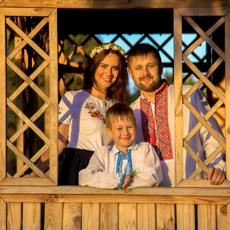 Happy family dressed in Ukrainian national costumes.の写真素材