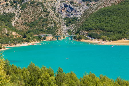 Beautiful landscape. Mountain lake. The Alps, Provence, France. Bridge and shipsの写真素材