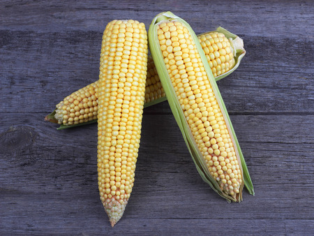 Corn on old wood background