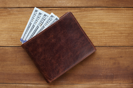 Wallet with money on wooden background. Closeupの写真素材