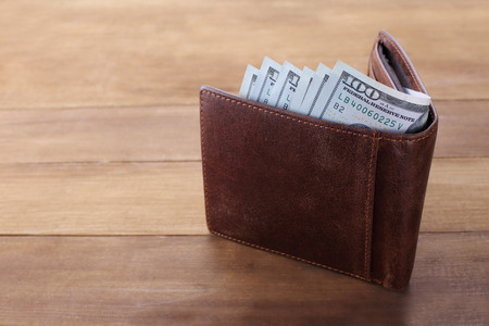 Wallet with money on wooden background. Closeupの写真素材