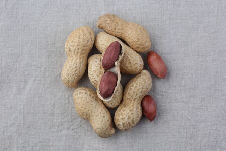 Peanuts on burlap background. Closeup