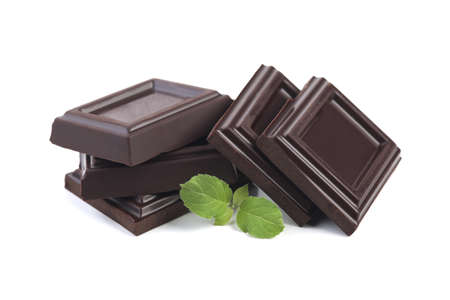 Dark chocolate with leaves isolated on whiteの写真素材
