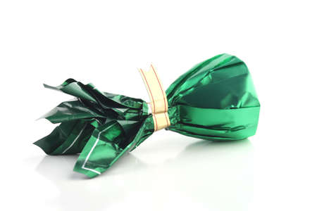 Candy in green wrapper isolated on white backgroundの写真素材