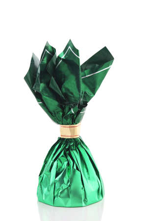 Candy in green wrapper isolated on white backgroundの写真素材