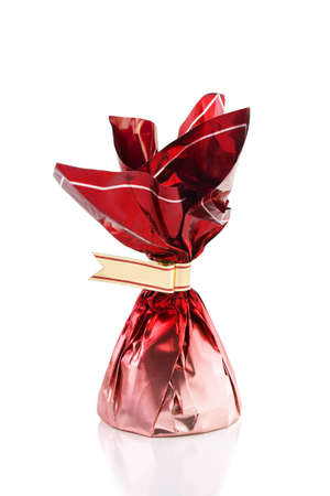 Candy in red wrapper isolated on white backgroundの写真素材