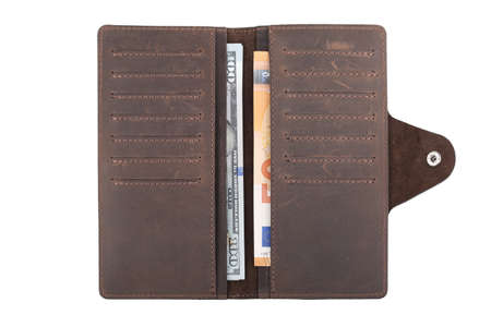 Brown leather wallet with euro and dollars banknotes isolated on white background
