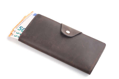 Brown leather wallet with euro banknotes isolated on white backgroundの写真素材