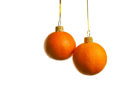 Juicy tangerines as a xmas balsl, isolated on whiteの写真素材