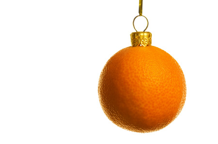 Juicy tangerine as a xmas ball, isolated on whiteの写真素材