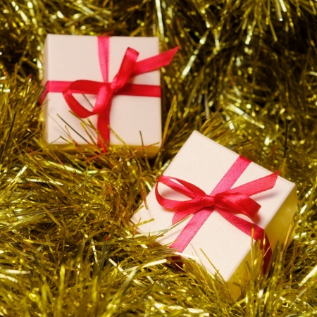 Gift boxes with red ribbon on abstract holiday backgroundの写真素材
