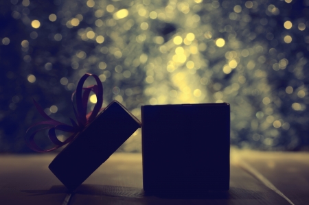 Gift box on abstract background in dark tonalityの写真素材