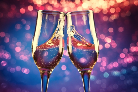 Two glasses of champagne with splashの写真素材