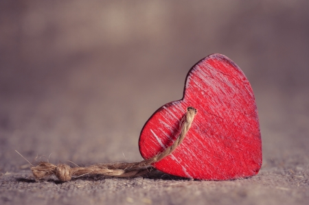 Valentine day concept. Card with red heart on fabric textureの写真素材