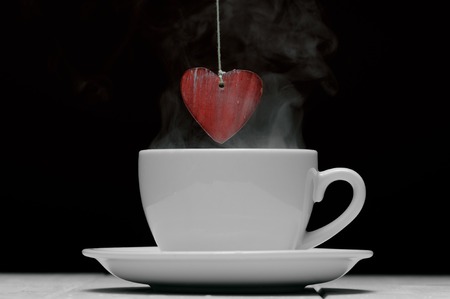 Cup of coffee with heart symbolの写真素材