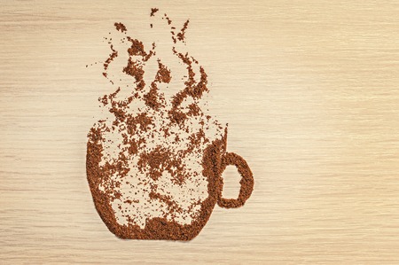 ground coffee in the form of coffee cup on the table