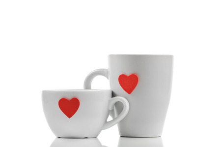 Cups with red heart isolated on whiteの写真素材
