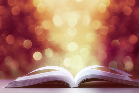 Open book against defocused lights