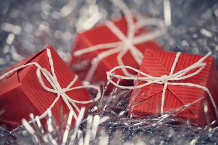 Close up of red gift boxes in abstract christmas decorationの写真素材