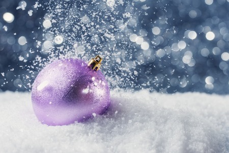 Christmas decoration in snow on abstract backgroundの写真素材