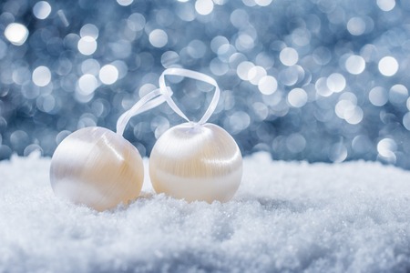 Christmas decoration in snow on abstract backgroundの写真素材
