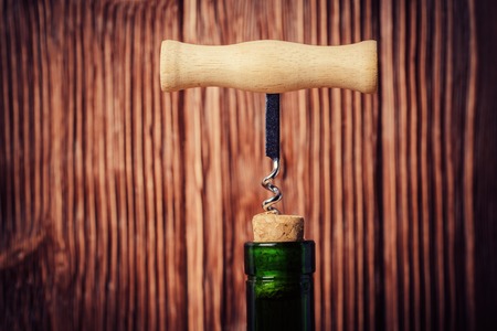 Close up of corkscrew over defocused wooden backgroundの写真素材