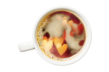 Double exposure of coffee cup and heart shaped defocused lights. Isolated on white backgroundの写真素材
