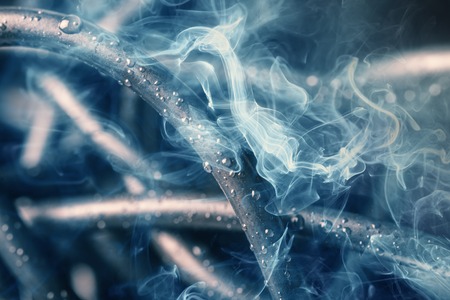 Tangled wires with smoke and water drops, abstract backgroundの写真素材