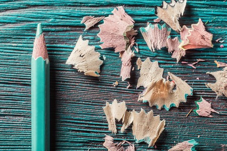 Pencil and residuals of grinding on rustic wooden backgroundの写真素材