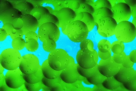 Abstract Background.  Oil and Vitamin Pills On a Water Surfaceの写真素材