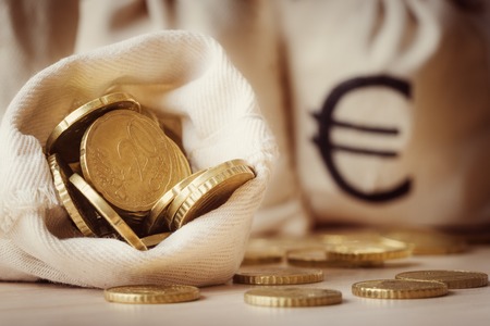 Euro coins in open money bagの写真素材