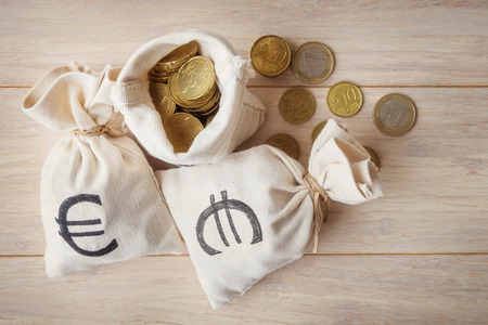 Euro coins in money bags, top viewの写真素材