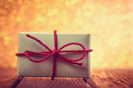 Gift box over yellow defocused lights