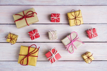 Many gift boxes over wooden backgroundの写真素材