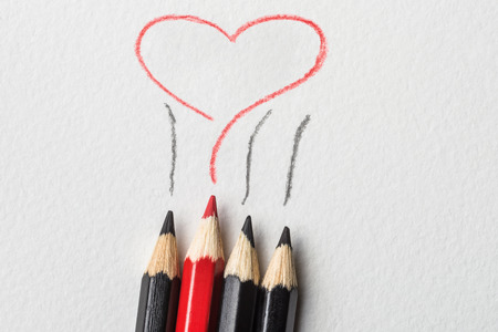 Love inspiration concept. Drawn heart by red pencil
