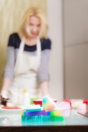 Woman is posing during soap making, selective focus on foregroundの写真素材