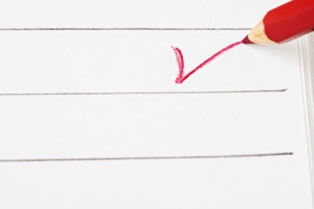 Red ticks over empty page with copy spaceの写真素材