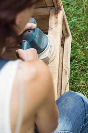 Top view of woman with polishing machine in handsの写真素材